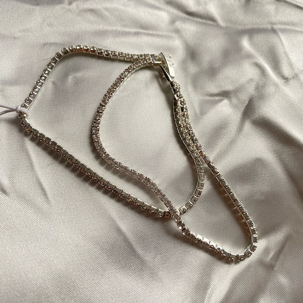 FASHIONNOVA silver rhinestone bracelet.